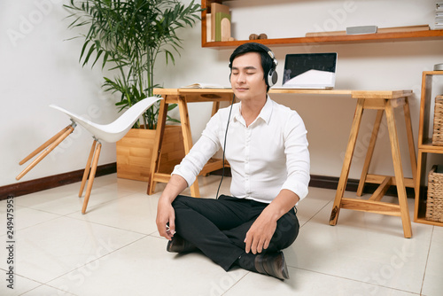 Meditating Asian businessman