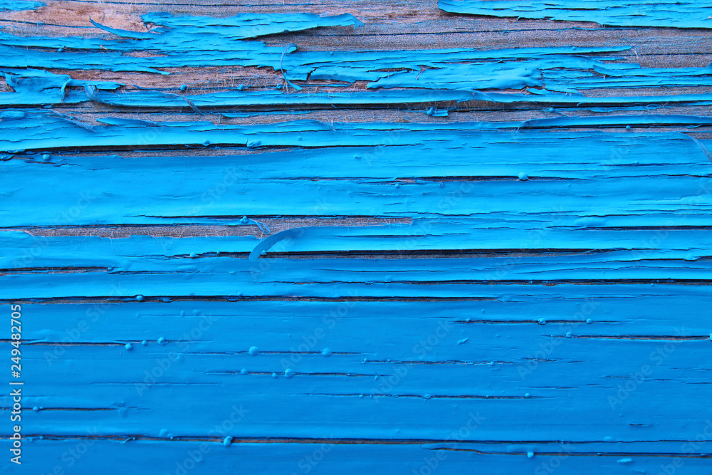 Old log painted in blue. Close-up. Background. Texture. Old log painted in blue. Close-up. Background. Texture.