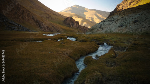 Sunset view to Tash-Rabat river and valley in Naryn province, Kyrgyzstan photo
