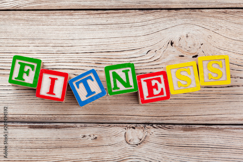 Wooden toy Blocks with the text: fitness