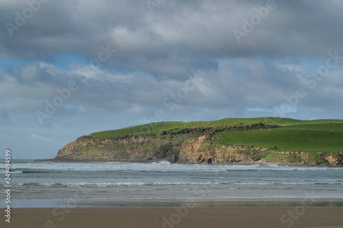 Surat Bay. Owaka New Zealand. Coast, beach and ocean. Hills photo