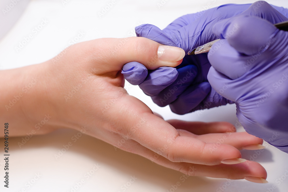 custom made wallpaper toronto digitalCloseup shot of master in rubber gloves covering nails with base gel in the beauty salon. Perfect nails manicure process