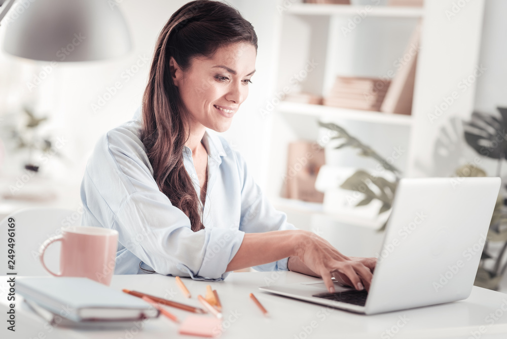 Young would-be entrepreneur writing business plan working at home Young would-be entrepreneur writing business plan working at home