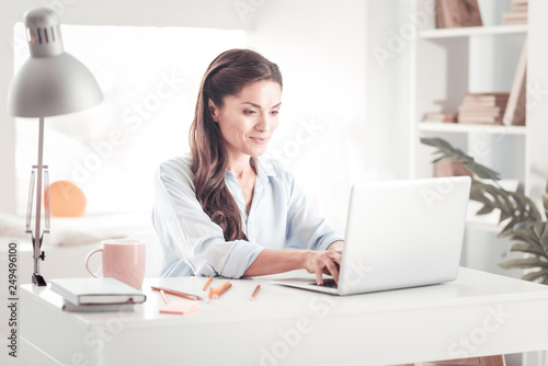 Prosperous professional businesswoman working from home