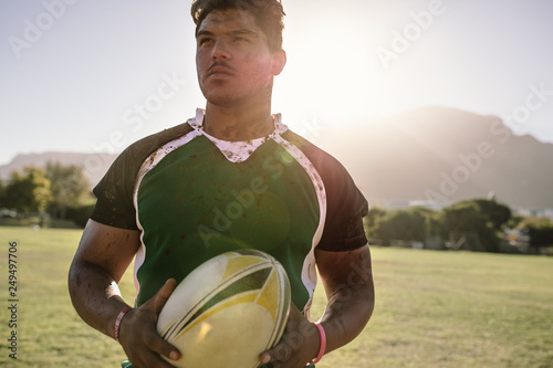 Rugby player holding ball