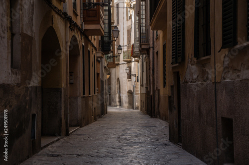 in the streets of palma de Mallorca Spain with great sky in the background  great city photography small little street with typical colour