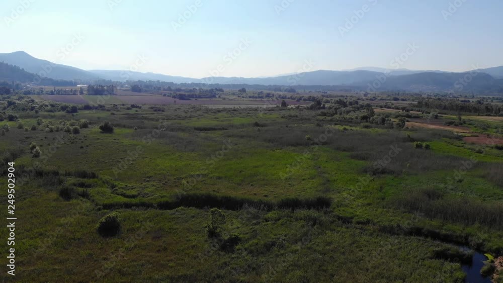 An aerial view from lush Aegean marshes and rivers that flow through them. Shot in  Akyaka (Gulf of Gokova, Aegean Sea) on a spring day.