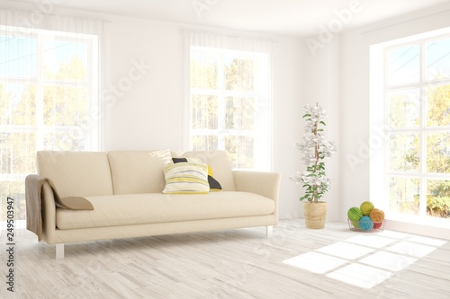 White stylish minimalist room with sofa and autumn landscape in window. Scandinavian interior design. 3D illustration © AntonSh