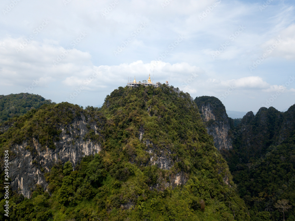 Aerial image of big Buddha on the top of Tiger Cave Temple, Wat Thum Sua, Krabi, Thailand.