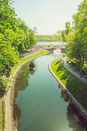 Landscape Gomel City Park with a pond in the center among the trees