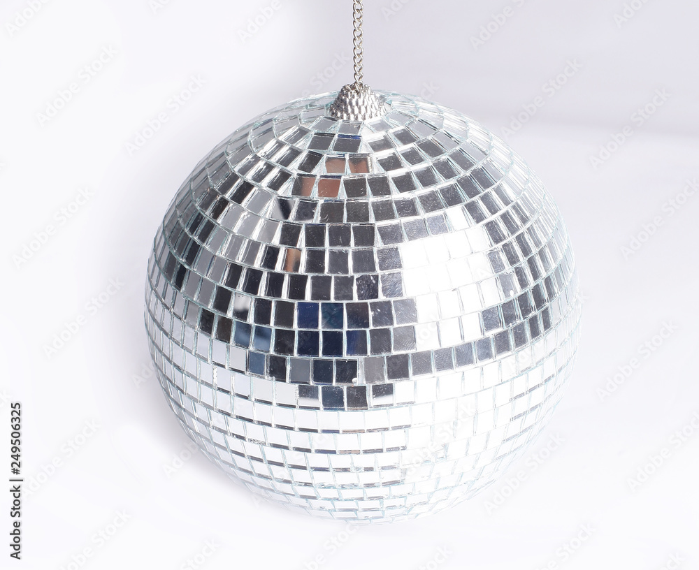 Fototapeta premium closeup .hand holding a mirror ball.isolated on gray background