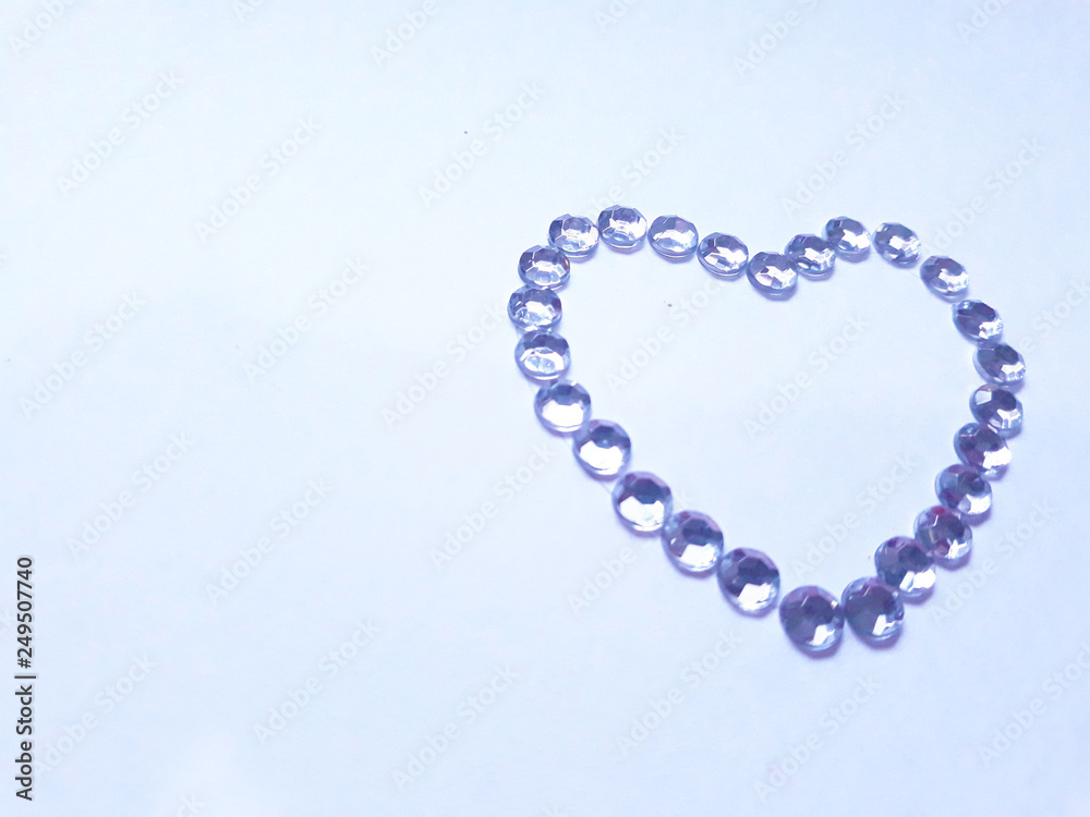 Obraz premium Diamonds shaped as heart on a light background