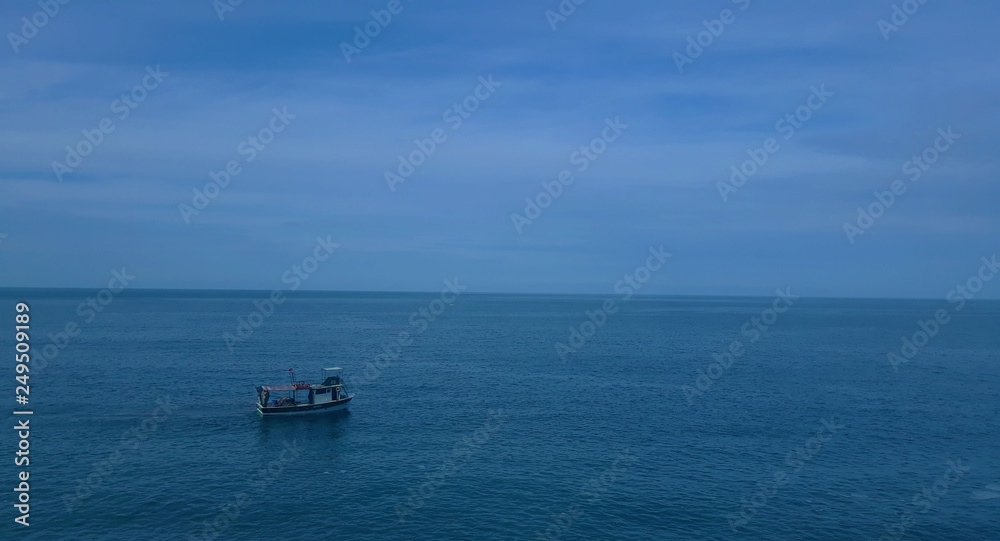 Fishing boat on the sea with blue sky