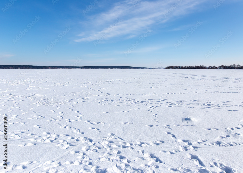 Traces of people in the snow in winter