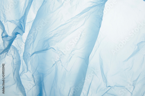 Light blue plastic garbage bag material as a background