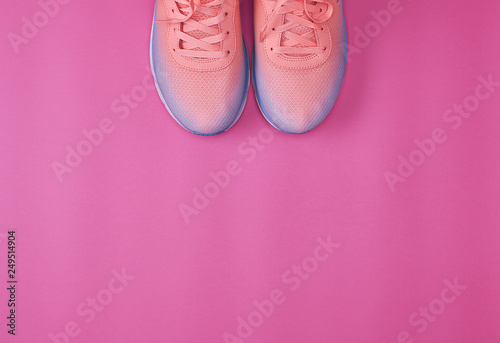 pair of pink sneakers with laces