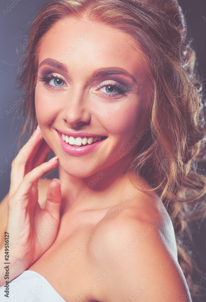 Beautiful woman with curly long hair on dark background . Beautiful woman with curly long hair on dark background .