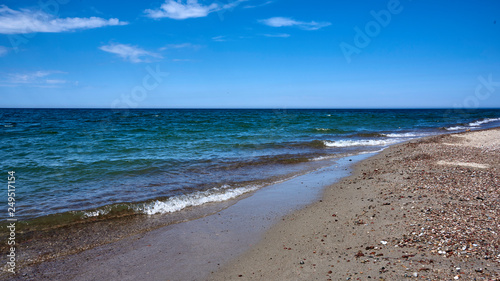 Russia. Kaliningrad. Village Yantarny (Amber). Beach. Baltic waves are rolling