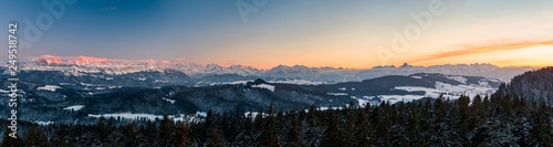 winter sunset panorama of the Bernese Alps including Eiger Mönch Jungfrau, Niesen and Stockhorn