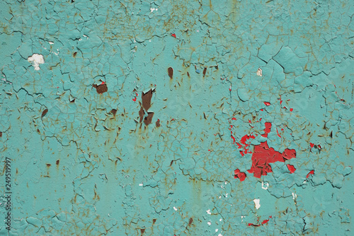 Old rusty iron sheet covered by old blue paint. Abstract background © andrey_semenenko