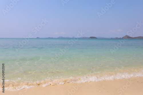 Fototapeta Naklejka Na Ścianę i Meble -  Beautiful sandy beach and soft blue ocean wave