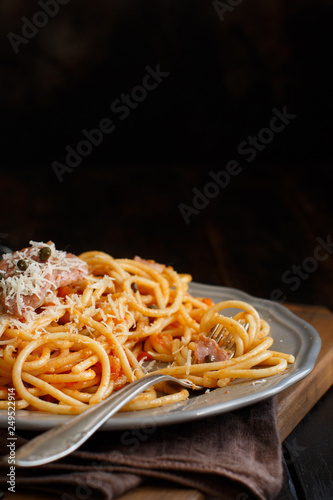 Pasta with chunks of fresh tuna  tomato and capers