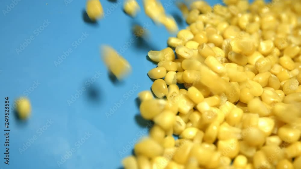 Canned corn kernels on green background. 2 Shots. Slow motion. 1 ...