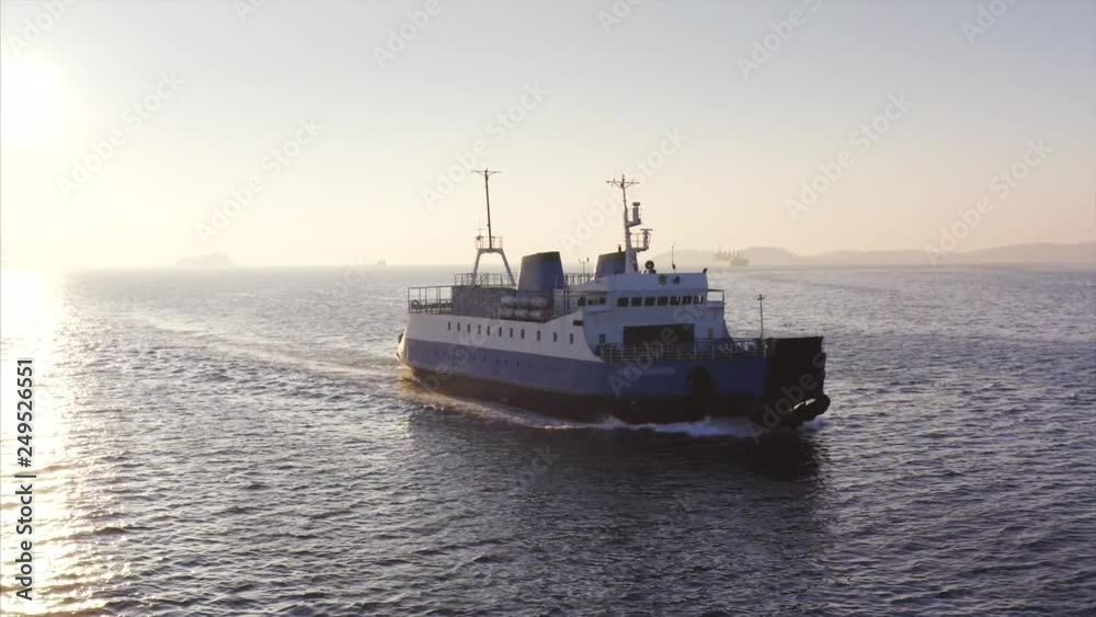 Beautiful zooming aerial view of ferry sailing to Vadivostok along the Eastern Bosphorus strait. Russia Beautiful zooming aerial view of ferry sailing to Vadivostok along the Eastern Bosphorus strait. Russia