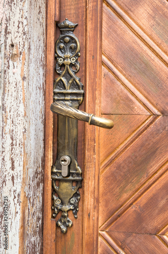 Old decorative handle and secret lock on wooden door , Bulgaria