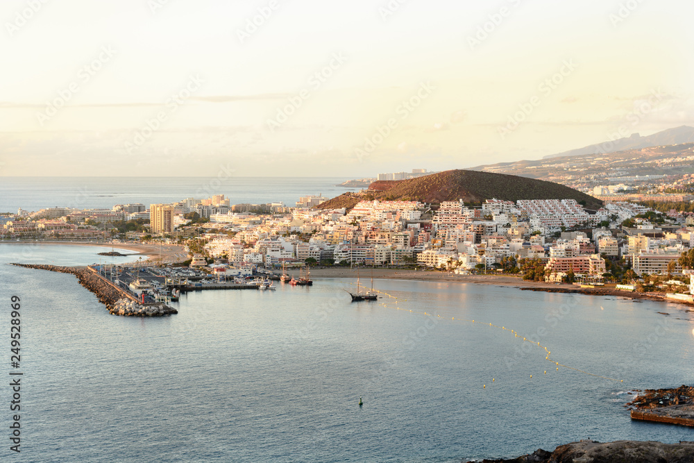 Aerial view over Los Cristianos beach and Adeje coastline in summer holiday, in Tenerife, Spain