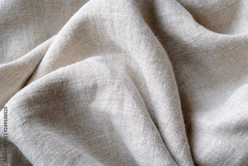 Gathered and folded texture of woven linen fabric Stock Photo