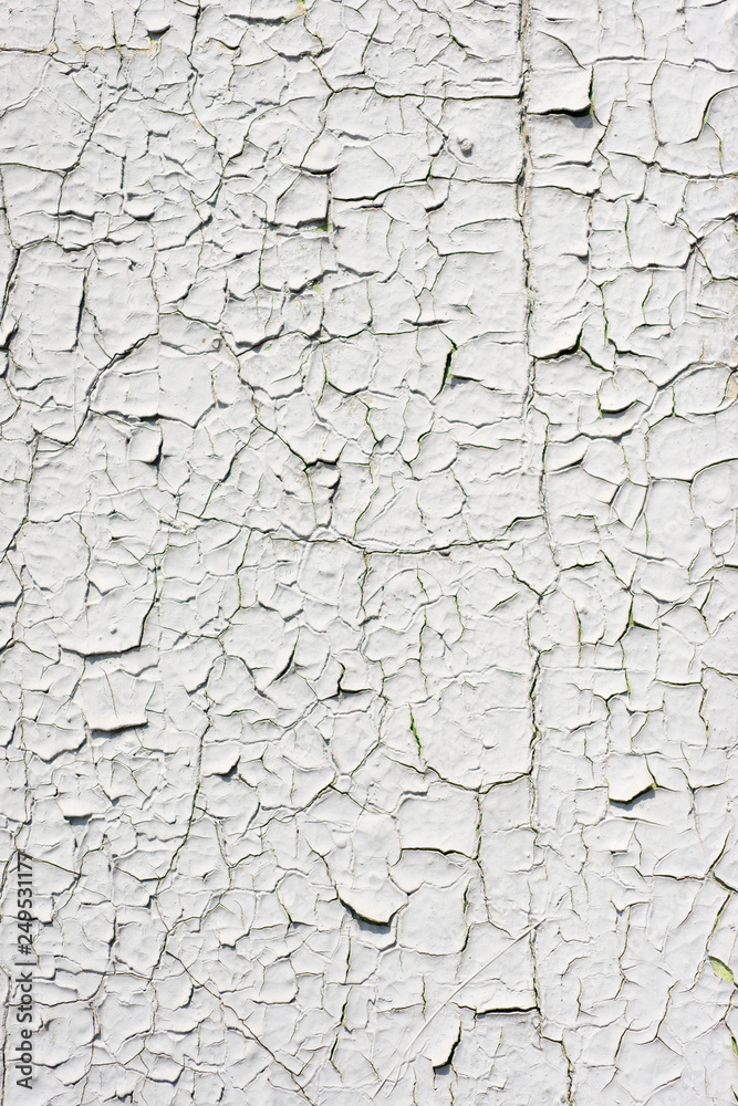 The iron sheet covered by old white paint. Abstract background The iron sheet covered by old white paint. Abstract background