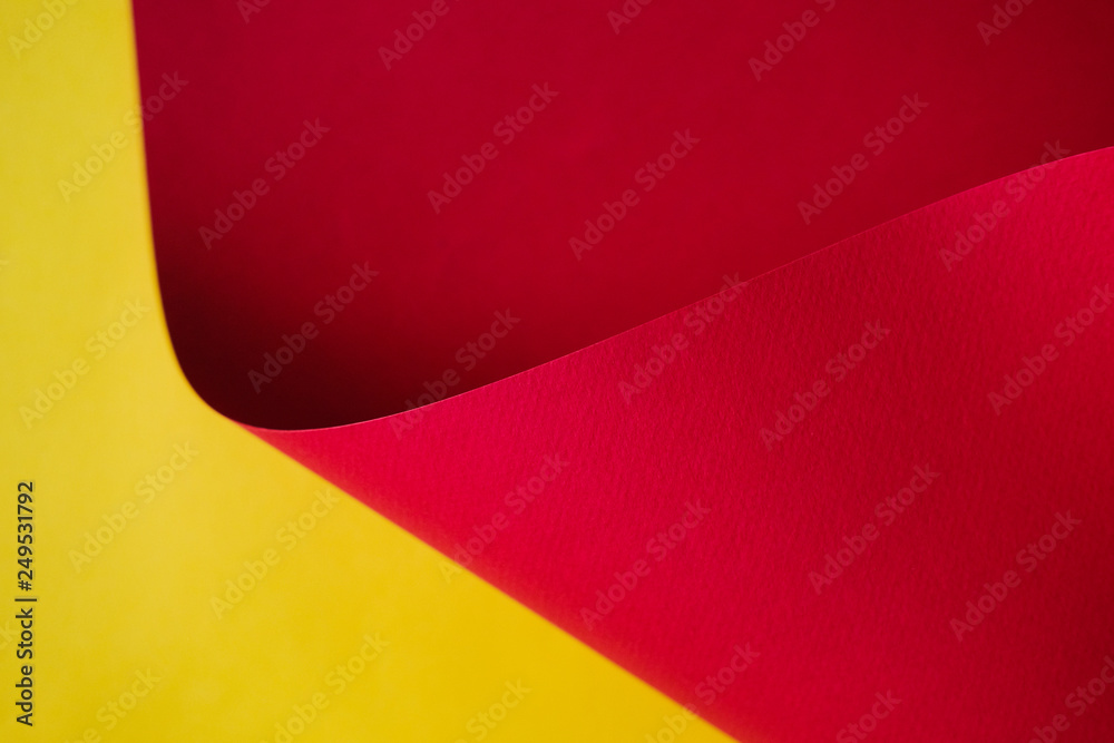 Abstraction of a design paper red and yellow. Empty space on monochrome paper.