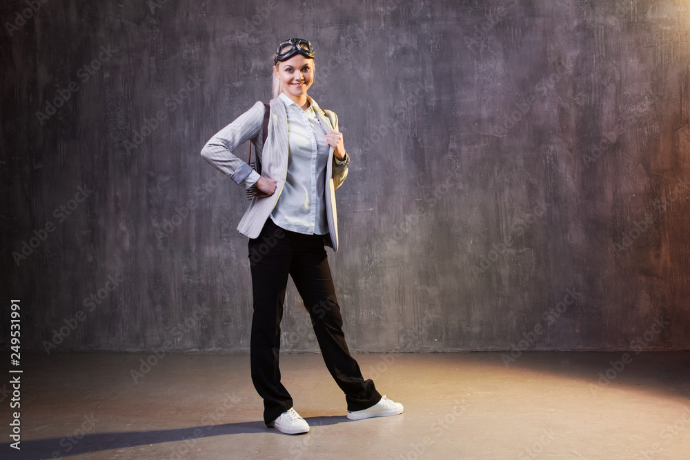 Young woman businesswoman with a jetpack on the back. Business acceleration concept, startup