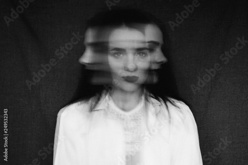 фотографія crazy portrait of girl with mental disorders and split personality
