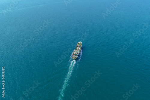 Aerial view Oil ship tanker transportation oil from refinery on the sea.
