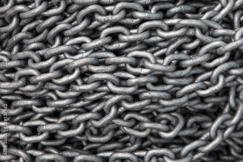 Large piles of steel chain connected the background Large piles of steel chain connected the background
