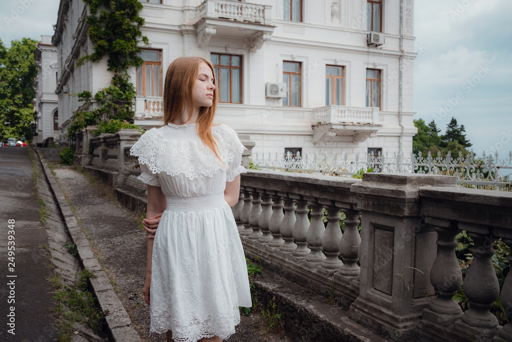 Fototapeta premium Attractive young woman enjoying her time outside in park
