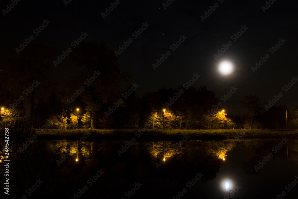 River at night against the moon River at night against the moon