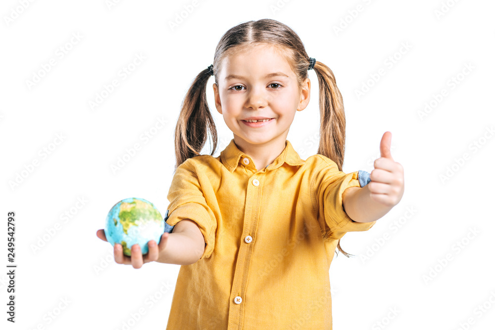 cute child holding globe model and showing thumb up isolated on white, earth day concept cute child holding globe model and showing thumb up isolated on white, earth day concept