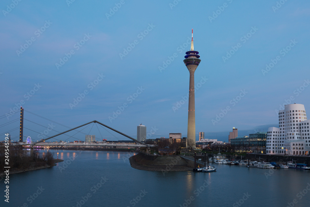 Media harbor with Rheinturm tower at night in Dusseldorf, Germany