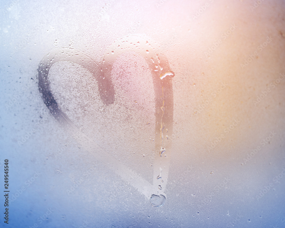 Fototapeta premium Drawing of heart on the misted glass.