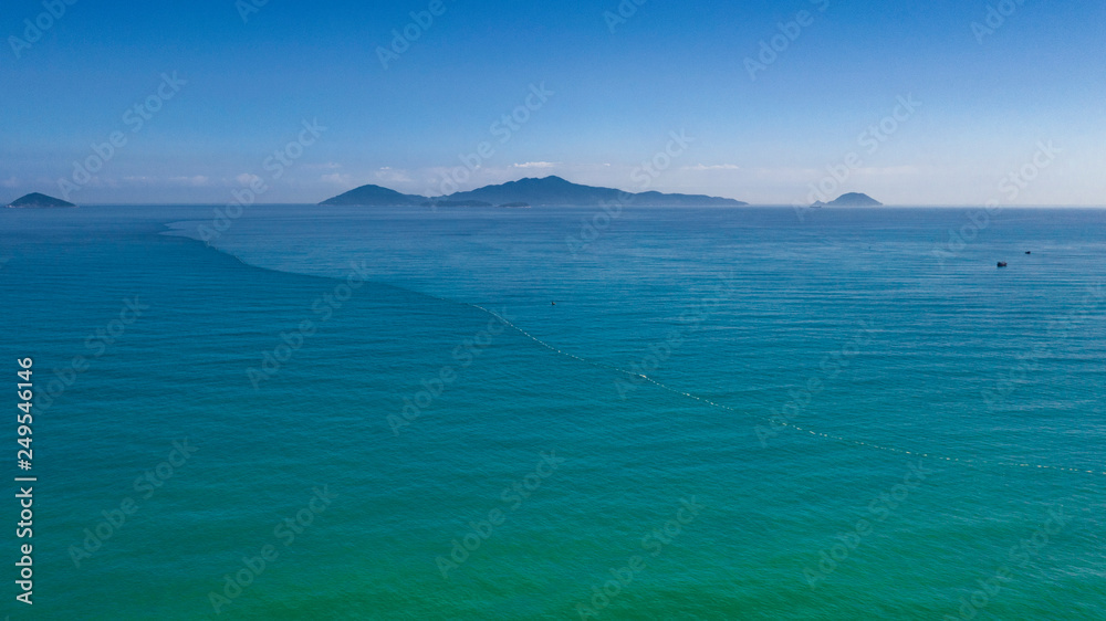 Cham islands in turquoise sea waters top view from Hoi An coast minimal seascape 