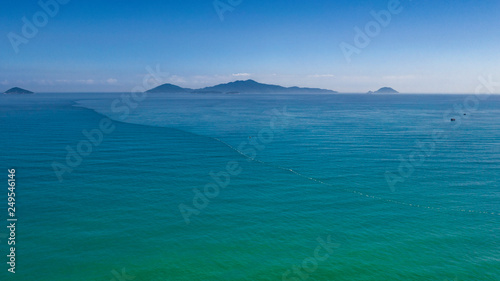 Cham islands in turquoise sea waters top view from Hoi An coast minimal seascape 