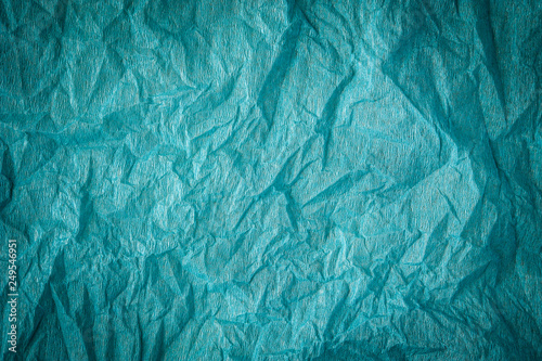 Grunge cyan paper texture. Crumpled old dirty cardboard distressed and industrial background design.