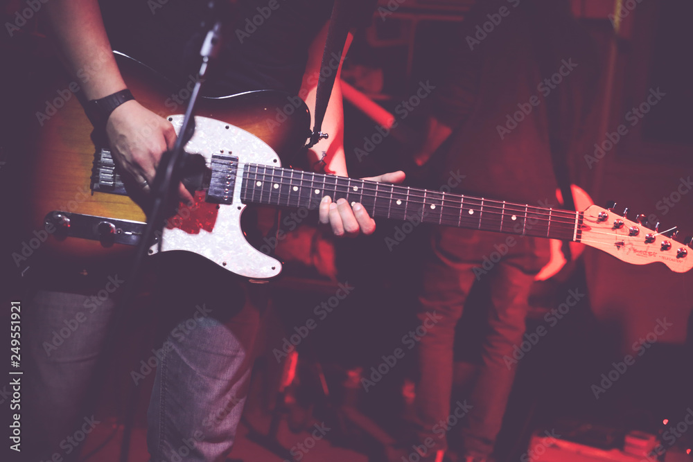 Obraz premium A guitarist makes a solo during a concert