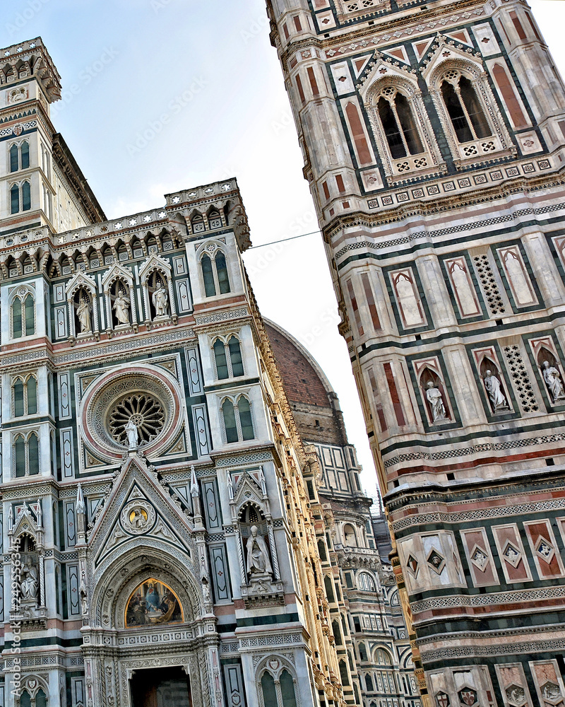 Duomo Florence Cathedral (Santa Maria del Fiore) is the third largest church in the world. Italian Renaissance. Awesome colored marble facade with sculptures and elegant Giotto tower. Italy, Florence