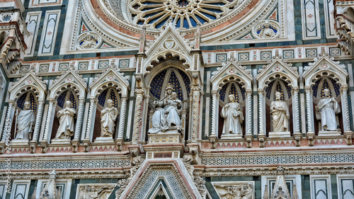 Italian Renaissance. Duomo Florence Cathedral is the third largest church in the world. Architectural details of awesome marble facade with sculptures, painting, rosette. Italy, Florence