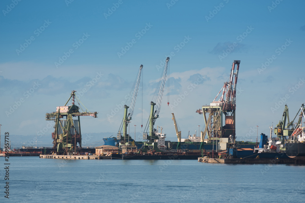 Industrial shipping cranes in the port of Taranto, Italy, Puglia