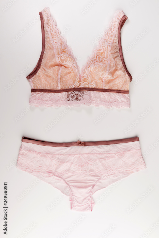 pink lace tender lingerie set isolated on a white background, top view pink lace tender lingerie set isolated on a white background, top view